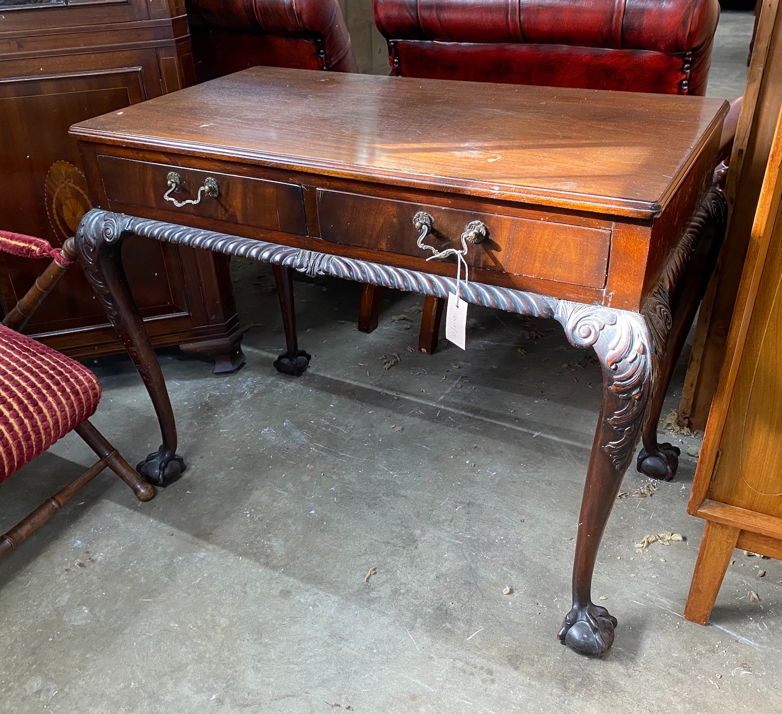 An early 20th century Chippendale revival mahogany two drawer side table, width 92cm, depth 52cm, height 71cm *Please note the sale commences at 9am.